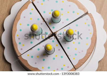 Baby Birthday cake with candles isolated on a wooden background 