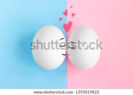 Two eggs kiss, love concept. Relationship between a man and a woman concept. 