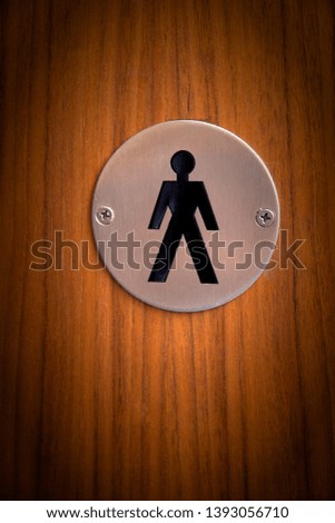 
Male restroom sign in a public building.