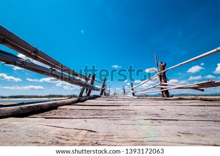 Wooden bridge across the river, with blue sky at Phu Yen Province, Viet Nam