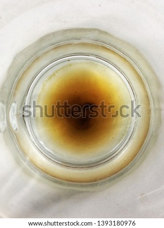 Closeup dirty coffee stains on a white cup surface texture background