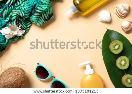 Flat lay elegance woman summer beach accessories on yellow background. Frame with feminine clothes and stuff: suntan lotion, fruits, sunglasses, dress, seashell. Top view. Summer vacation concept.