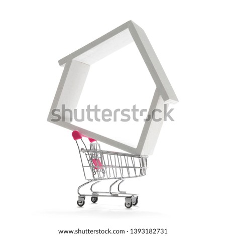 Shopping cart with house isolated on white background.