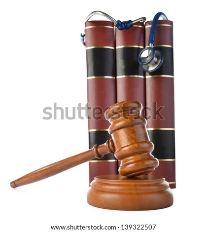 Medicine law concept gavel and stethoscope on books isolated on white background