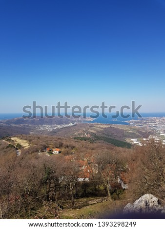 Trieste bay with city Trieste and Koper on picture. Picture shows petrol tanks with Trieste liquified natural gas terminal. Seaside in Italy and Slovenia. Picture was taken on 21th of March 2019. 