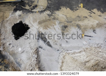 Different colors of dirt and sand on a construction site from above