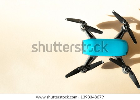Blue drone on yellow background
