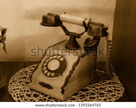 Old Telephone of wood in Sepia tone