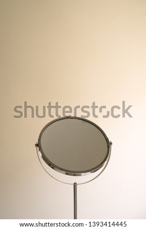 circular magnifying mirror with white background
