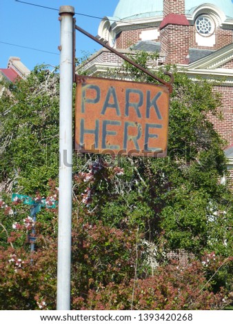Antique park here sign faded