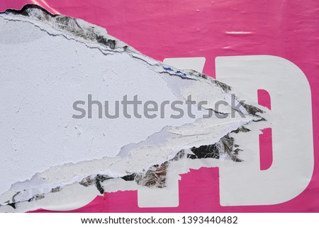 texture of a torn pink advertising bill poster close up Royalty-Free Stock Photo #1393440482