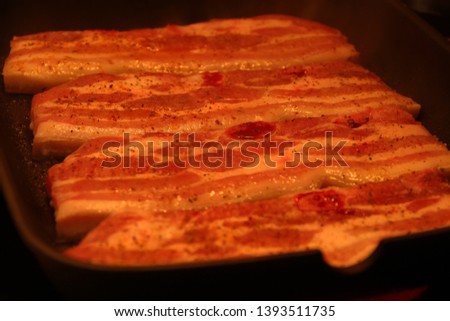 Grilled pork steak or Korea bbq pork belly bacon on the grill. Horizontal macro, rustic style