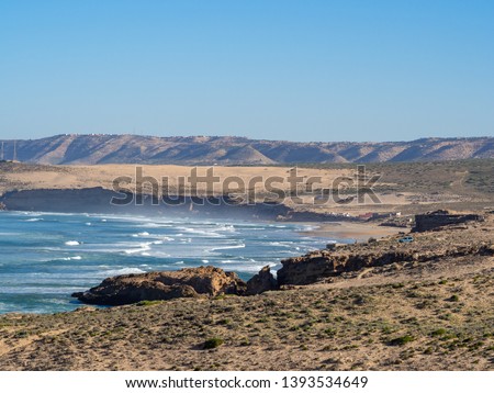 Morocco, North Africa [Moroccan landscape, rocky shore and seaside village, blooming flowres and surfing]