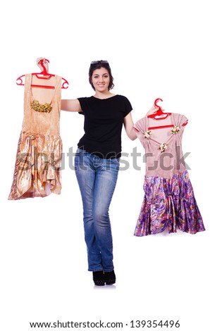 Woman trying to choose dress on white