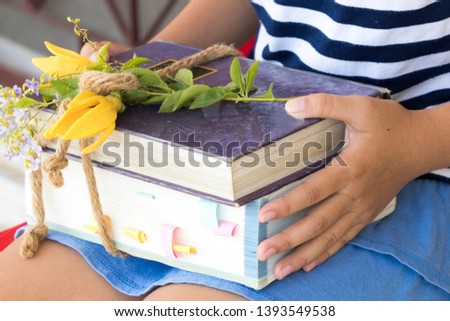 student children girl holding bundle notebook ,dictionary book for study 