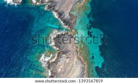 Aerial drone photo of tropical volcanic white rock deep turquoise paradise bay with beautiful colours