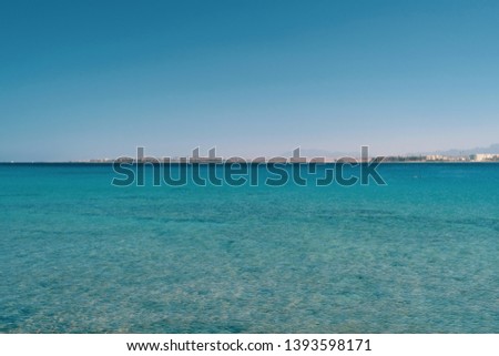 The sun is a beautiful beach turquoise sea blue sky vacation.