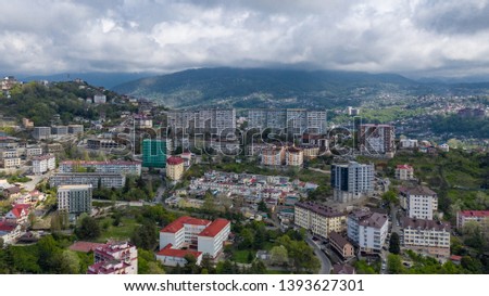 Aerial photography. Residential quarters of the city of Sochi with a bird's-eye view. Densely populated area of the city. City centre Sochi. The sky is grey the storm clouds. The view from the top.