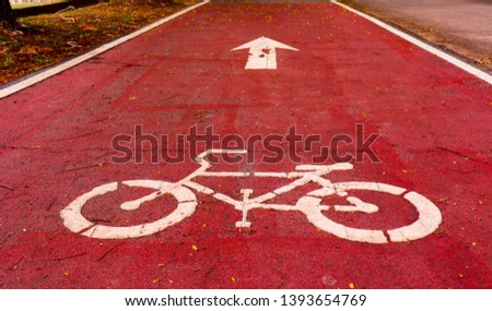 Cycling symbols, white letters on red roads