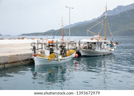 Early morning two fishing boats in the Kiparissi Lakonia village, Peloponnese, Zorakas Bay, Greece.