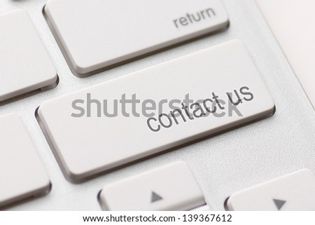 white keyboard with contact us key