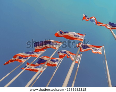 National flags of Thailand and blue sky background. Picture of waving Thai flag of Thailand in blue background.