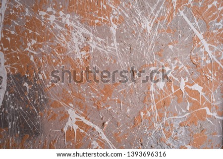 Texture decorative loft style. Repair in a photo studio. The walls are painted gray orange.