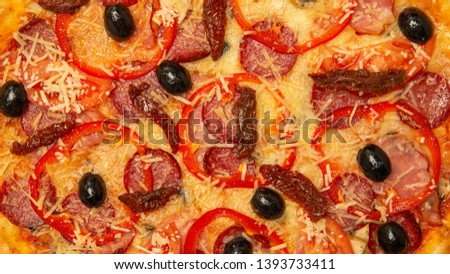Background pizza. texture of pizza with sausage cheese and pepper olives.