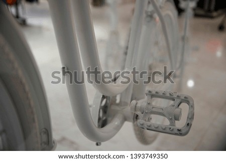 White bicycle pedal in close range with blur background