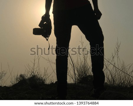 A back light photo of a photographer