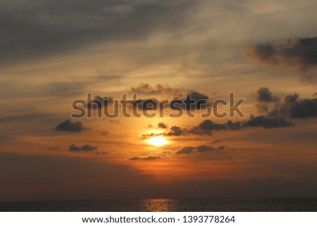 Sunset over Thailand beaches with clouds enhancing the effect