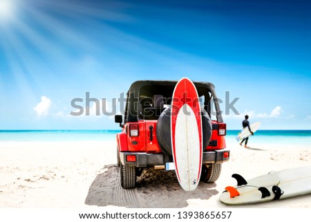 Summer car on beach and free space for your decoration. Surfer on beach and blue sky. 