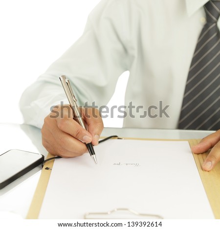Businessman signing a document