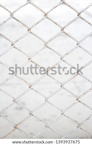 Wire mesh in front of white background