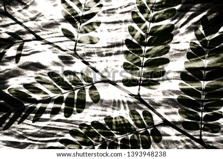 Abstract tie dye patterrn with leaves background
