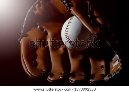 Baseball glove hand holding a baseball