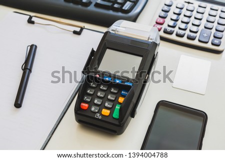 Credit card machine on the table.
