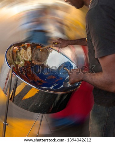 Carribean metal steel drum played by a musician Royalty-Free Stock Photo #1394042612