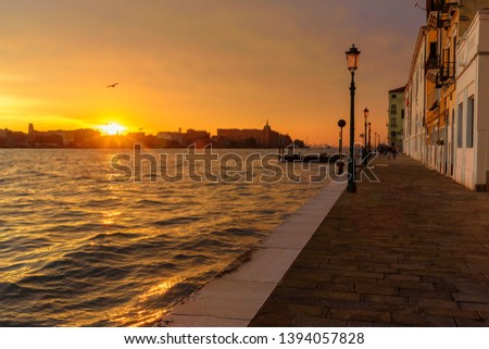 Fondamenta Zattere Allo Spirito and Venetian Lagoon on sunset in Venice. Italy
