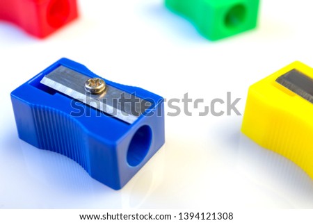Large pencil sharpener on a white isolated background, close-up with space for the text.