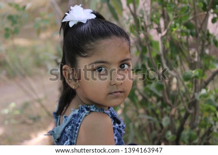 cute Indian girl playing in park, outdoor kids playing, shooting on white background 