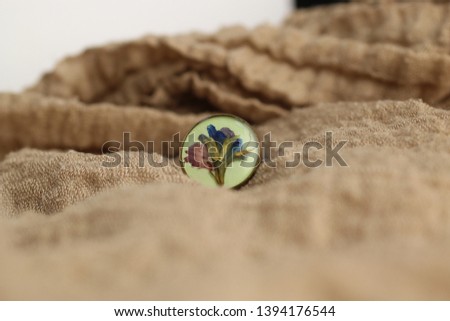 Macro photography of jewelry and bijoux in natural fabrics. Retro style, rustic style, and country style Royalty-Free Stock Photo #1394176544