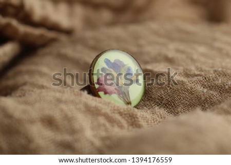Macro photography of jewelry and bijoux in natural fabrics. Retro style, rustic style, and country style Royalty-Free Stock Photo #1394176559