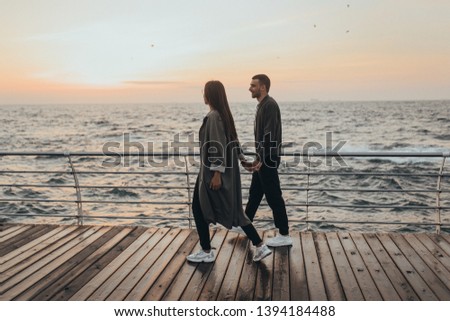 
Beautiful loving couple walking at sunset