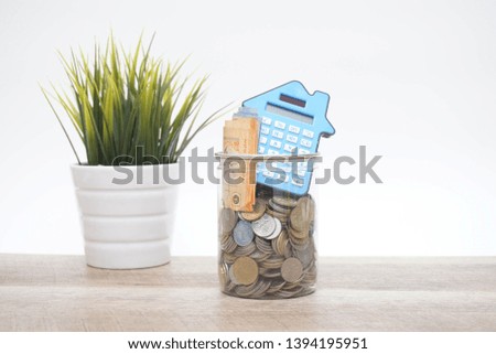 financial concept, calculator, coin and paper money