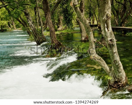 The Krka National Park is located entirely within the territory of Šibenik-Knin County and encompasses an area of 109 square kilometers along the Krka River peace cascade waterfall mossy river lake