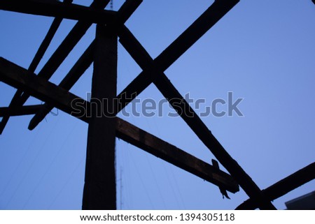 Old wooden house structure before roofing