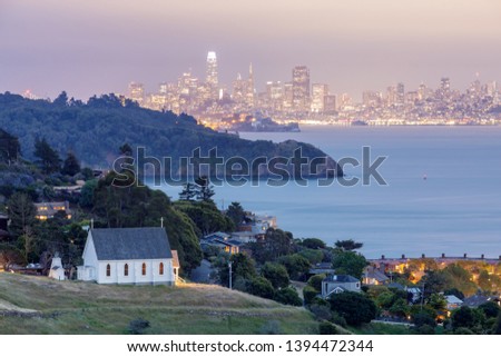 Dusk over St Hillary's Church, Angle Island, Alcatraz Prison, San Francisco Bay and San Francisco Skyline. Tiburon, Marin County, California, USA. Royalty-Free Stock Photo #1394472344