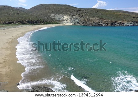 Photo of famous beach of Kolympithres with deep turquoise sea, Tinos island, Cyclades, Greece