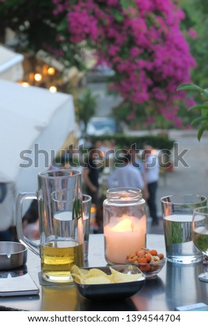 table with drinks and snacks and a candle